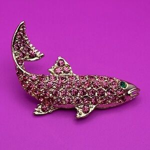 Vibrant pink colored crystal encrusted silver salmon with emerald eye